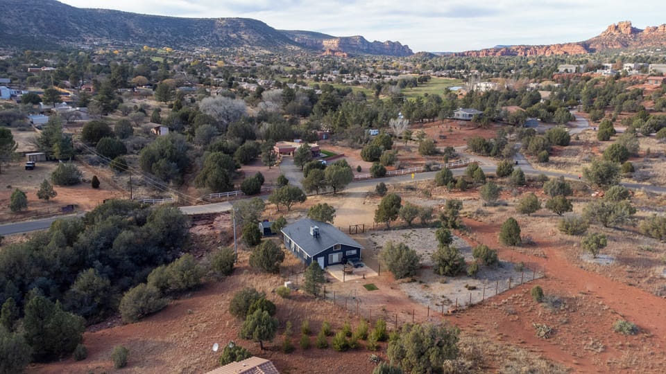 Surrounding mountains and nearby golf course create a serene stay.