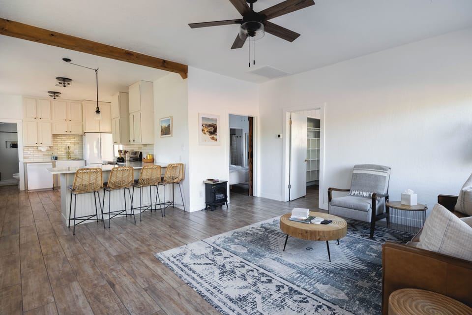 Open concept with full kitchen, bar seating and cozy living room.