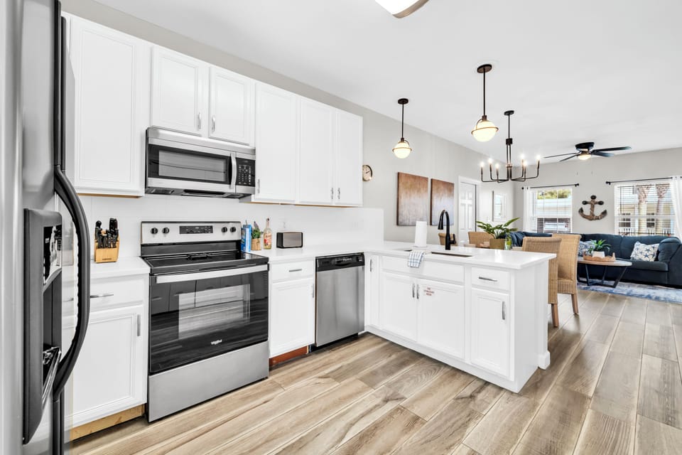 Your bright, fully-equipped kitchen flows seamlessly into the living area, perfect for preparing meals while staying connected with family and friends.