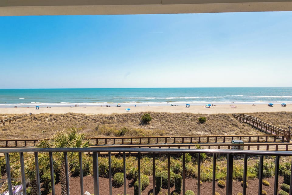 Oceanfront balcony with sweeping views and direct beach access