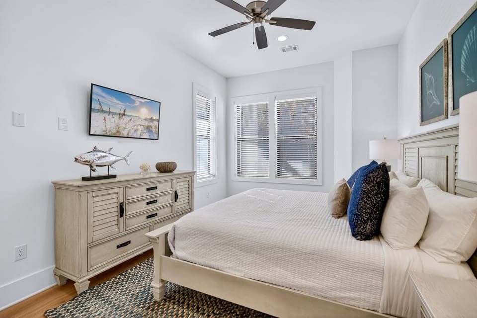 1st Floor - King suite with a private ensuite bath and walk-in shower offers a relaxing, spa-inspired space for restful nights and refreshed mornings during your beach getaway.