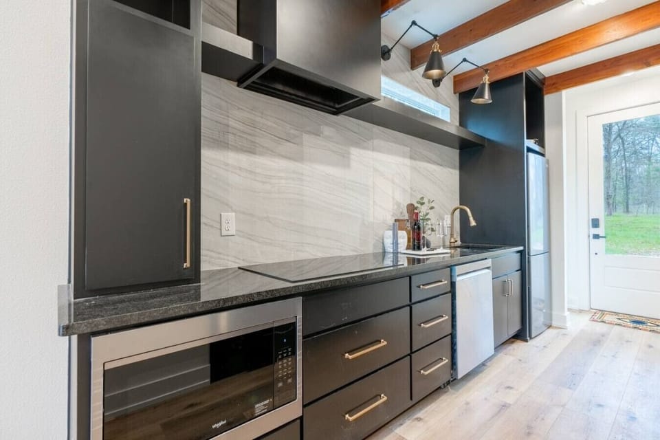 Contemporary kitchen featuring premium appliances, clean lines, and ample counter space.