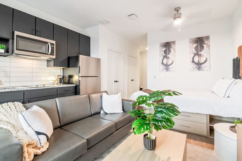 Kick back in a thoughtfully designed living area featuring comfortable seating and plenty of natural light.