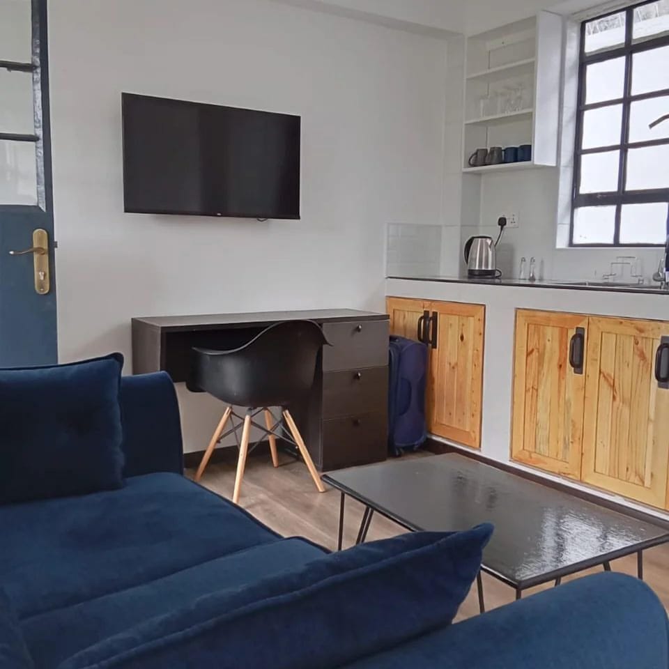 Deluxe Double Room, Garden View | Living area | 32-inch Smart TV with digital channels