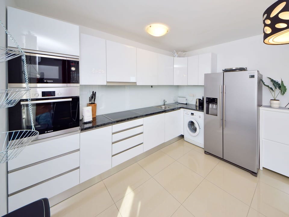 Kitchen, Flooring, Countertop, Interior Design, Cabinetry, Wood, Major Appliance, Floor, Kitchen Appliance, Furniture