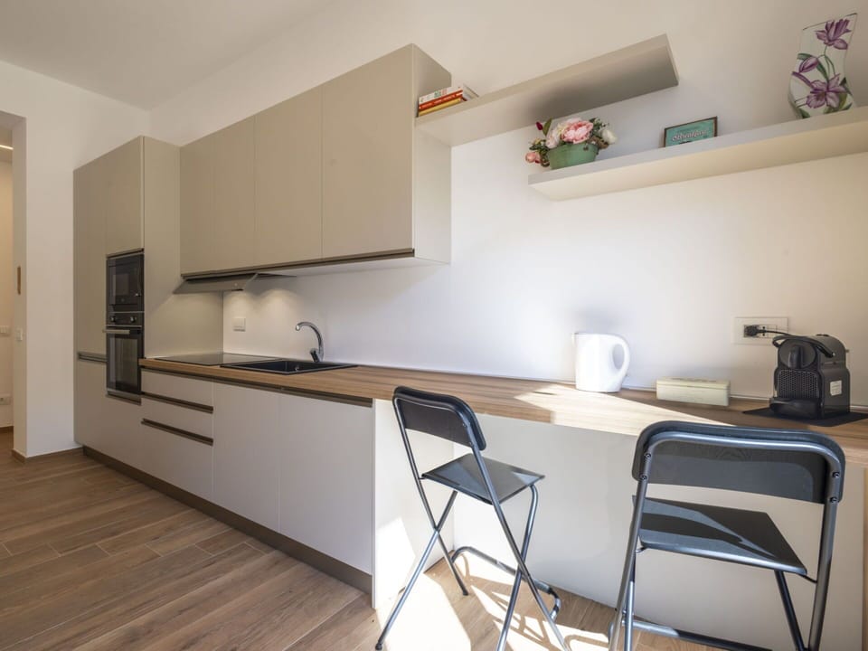 Furniture, Interior Design, Countertop, Flooring, Kitchen, Wall, Wood, Cabinetry, Kitchen Appliance, Floor