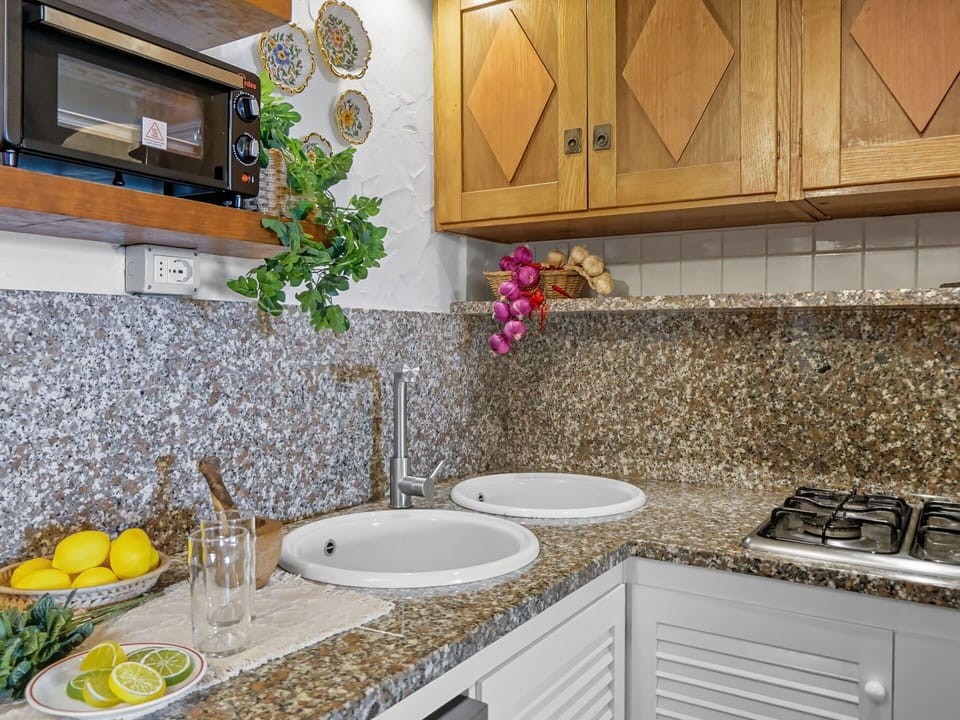 Countertop, Kitchen, Plumbing Fixture, Interior Design, Tap, Sink, Kitchen Appliance, Cabinetry, Flooring, Plumbing