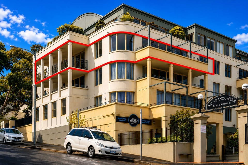 Salamanca Mews is a modern, secure apartment complex in one of Hobart's most sought-after locations. The apartment is highlighted in red to clearly show its position on the second floor, featuring an expansive wraparound balcony.