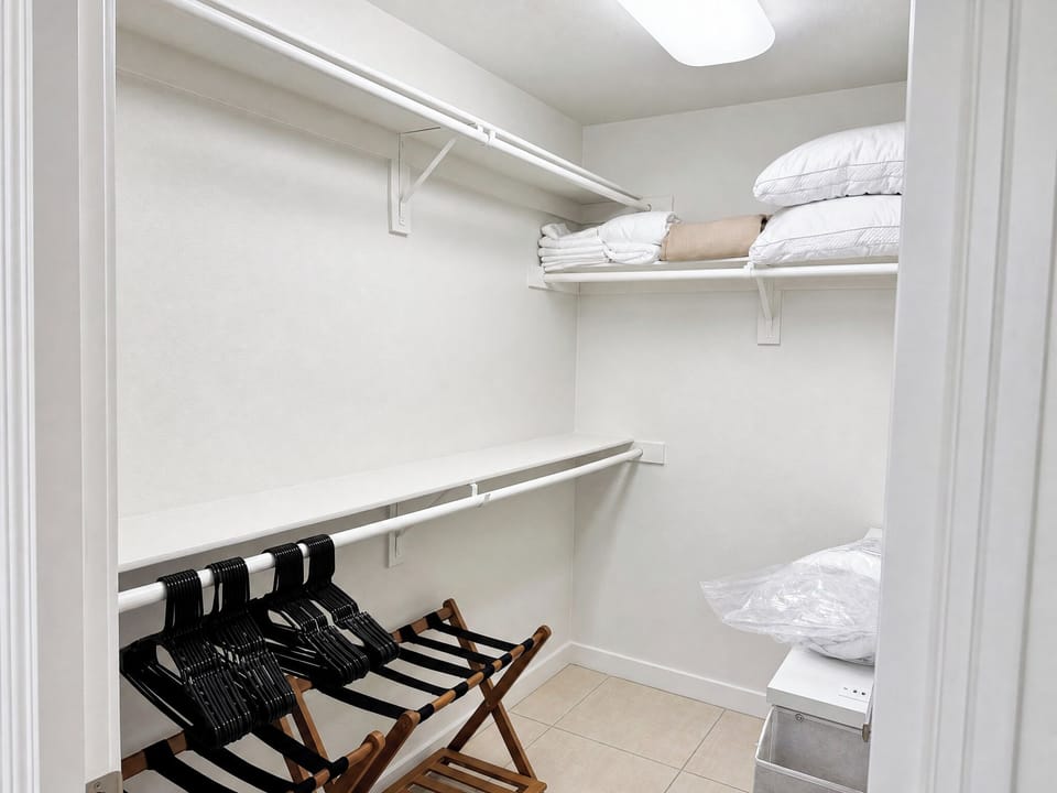 Your walk-in closet awaits with fresh linens, plenty of hanging space, and thoughtful storage to help you settle in and feel right at home.