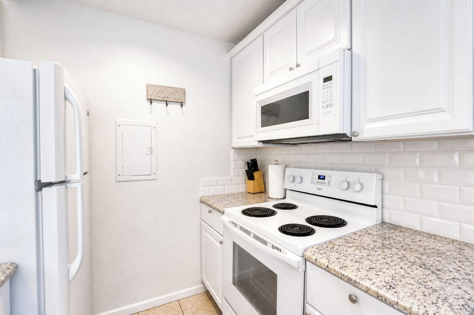 Your fully equipped kitchen features modern appliances and a bright, clean space perfect for preparing meals during your stay.