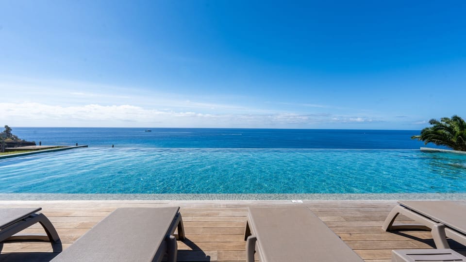 Dive into the shared infinity pool and admire panoramic ocean views — a peaceful escape surrounded by beauty and calm. #InfinityPool #OceanView #LuxuryLifestyle