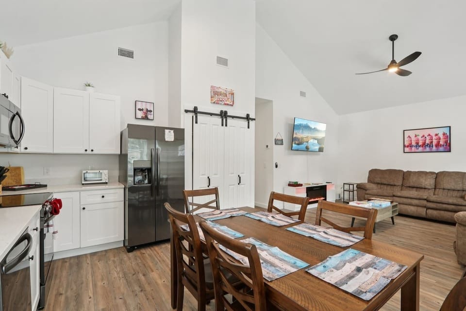 Open concept with Dining Table for 6, dishware for 10+ to include children's dishware, fully stocked kitchen, comfy reclining sofas, full-size arcade system, Smart TV, and Xbox
