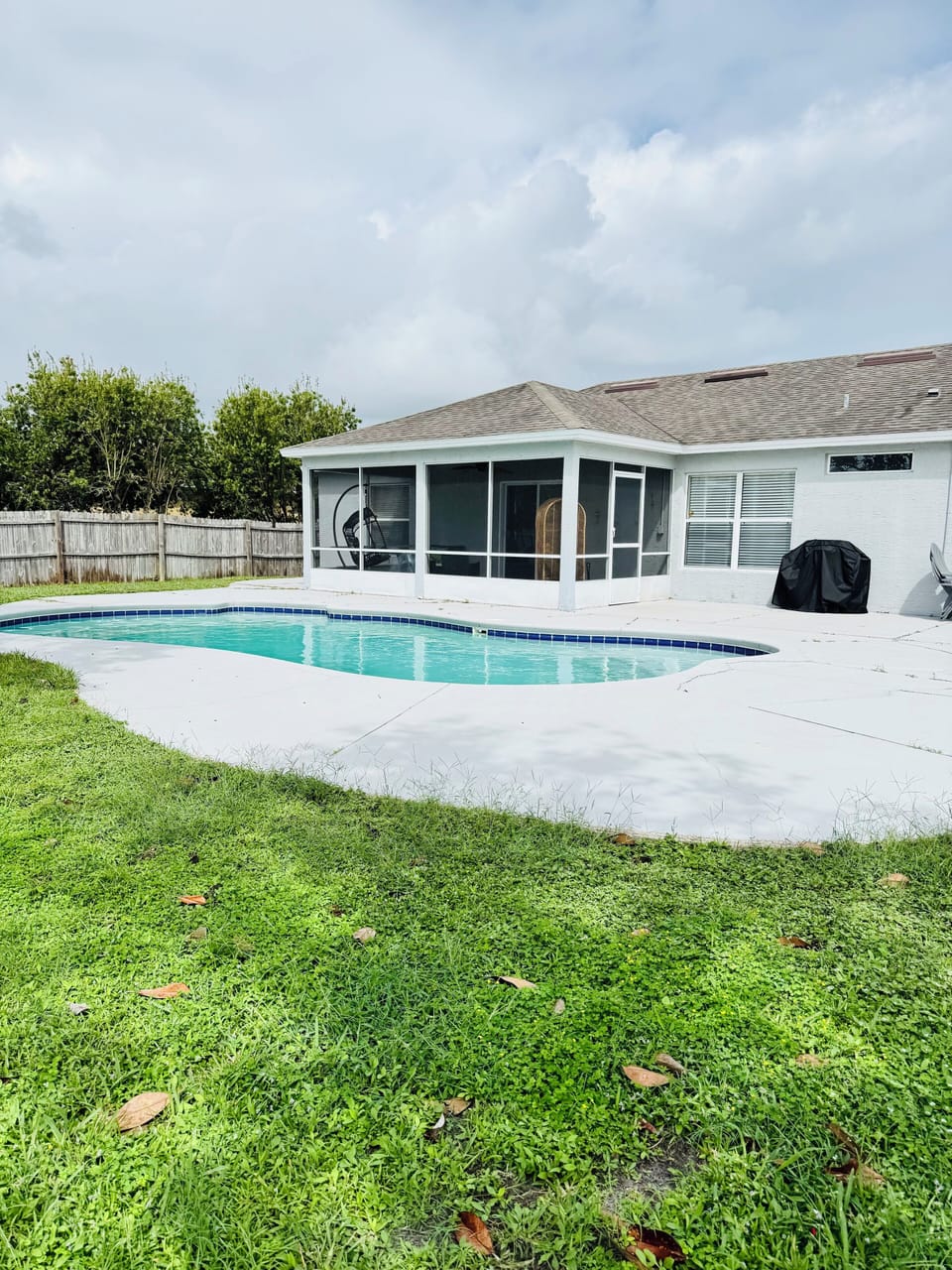 Relax by the sparkling pool or grill out in your private fenced backyard