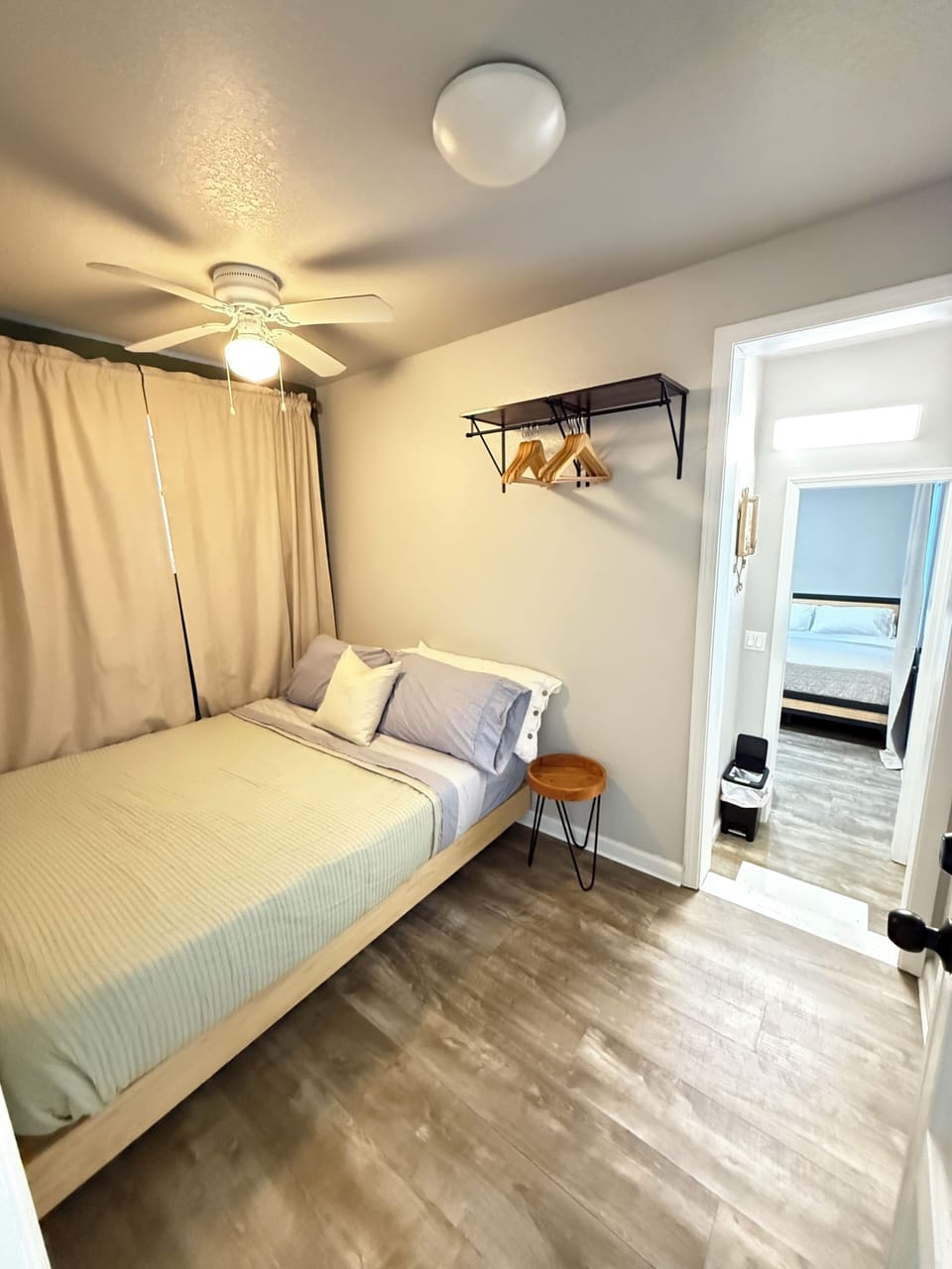 Bedroom with Queen size bed and second entrance to the front or backyard.