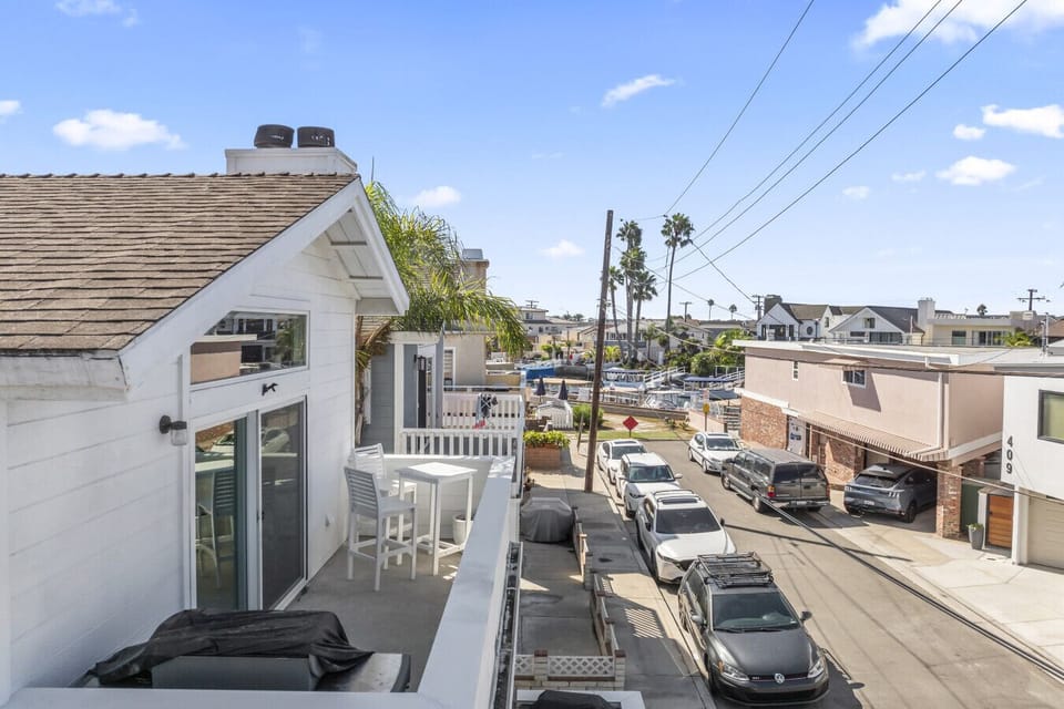 Sunlit balcony overlooking the neighborhood—perfect for morning coffee or evening unwinding.