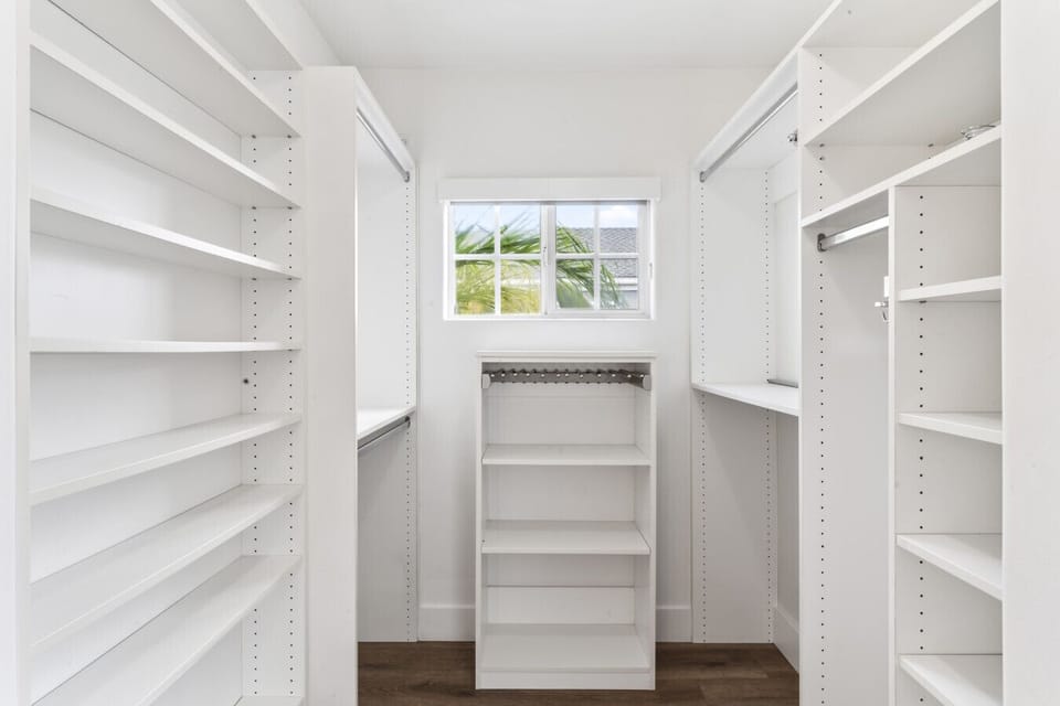 Spacious walk-in closet offering ample storage for extended stays.