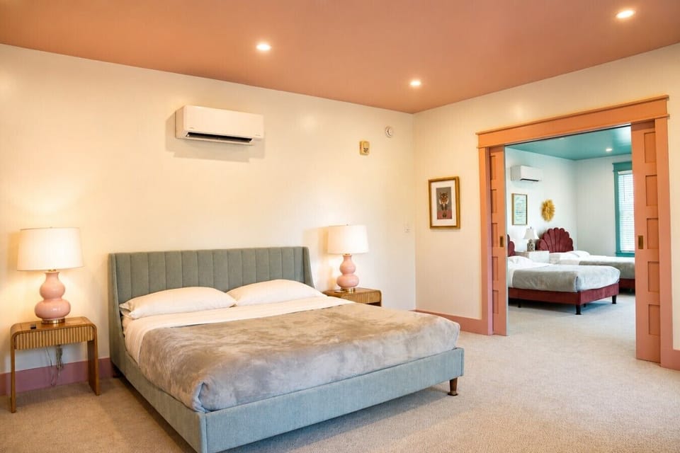 Pocket doors connect the king room to the family room with two full size beds, creating a private suite that sleeps the whole crew at Parkway House Goshen. Each room has its own mini split, so everyone can set their perfect temperature.