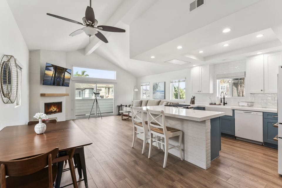 Bright open kitchen & living space w/ large island, bar seating & room to gather