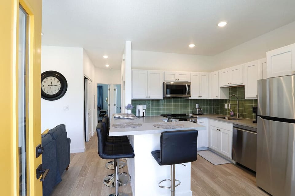 Open kitchen with bar seating for easy meals and conversation.