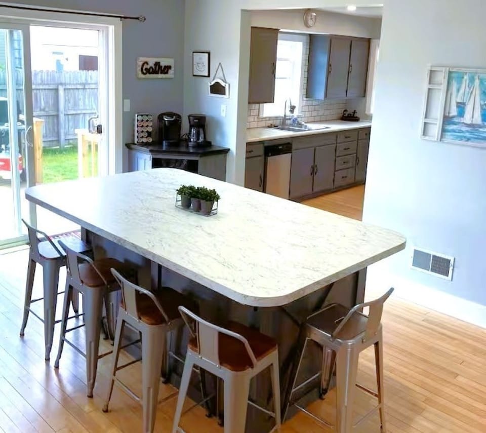 Dining room with large center island and coffee bar