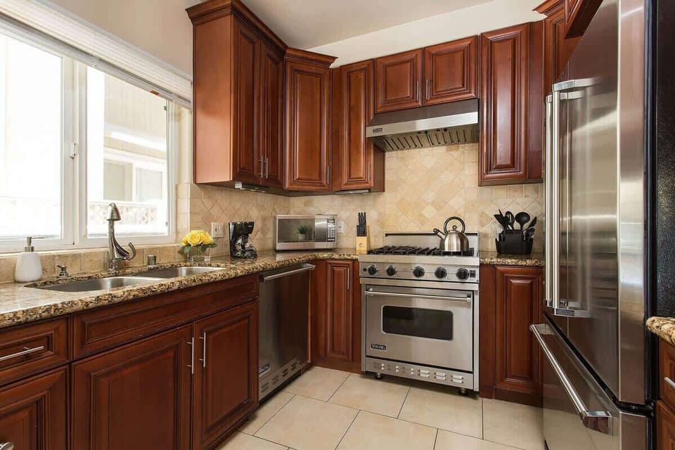Fully equipped kitchen with rich wood cabinetry