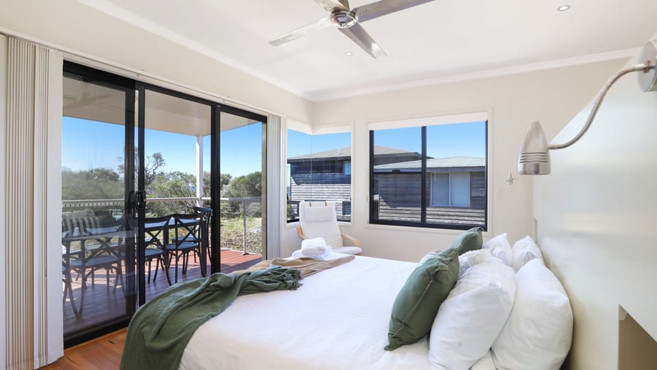 The Break | Bedroom 1 | King | Ceiling fan | Balcony access | Views