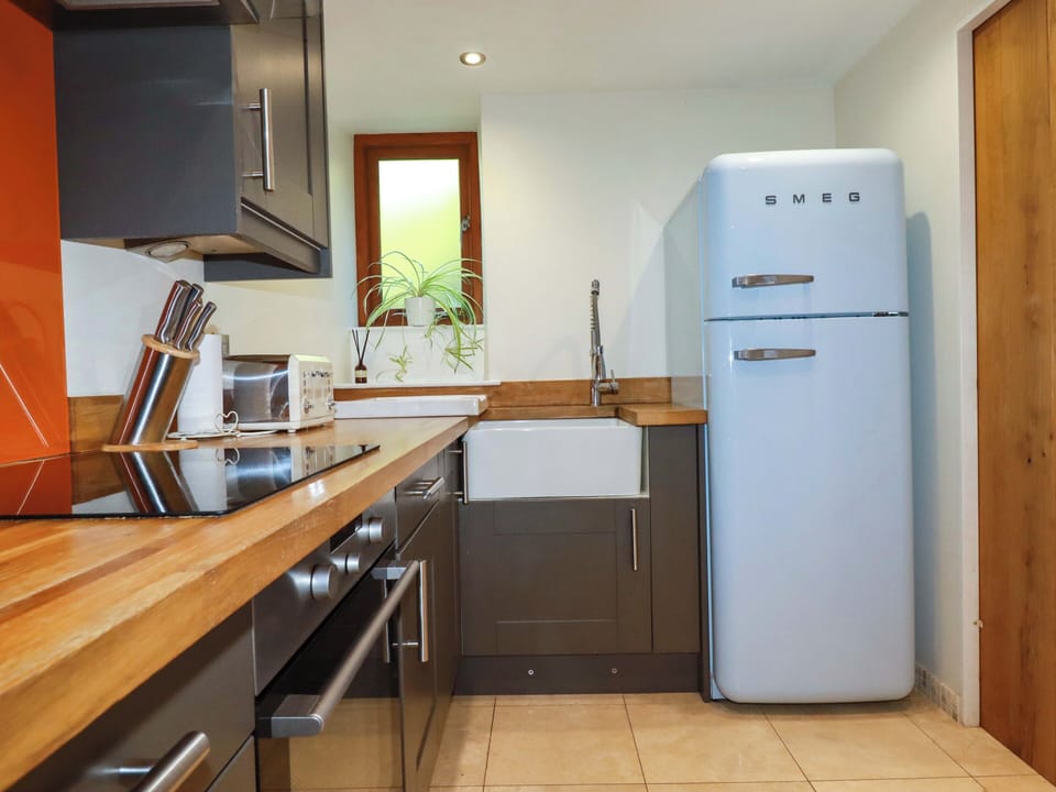 Fridge, microwave, cookware/dishes/utensils