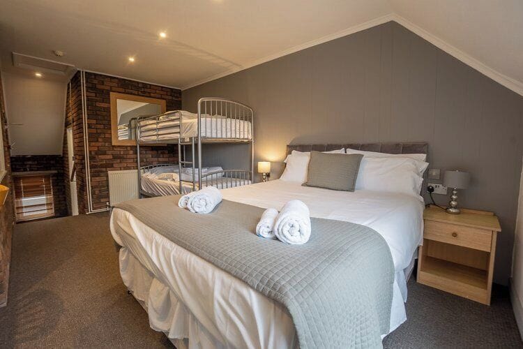 Family Quadruple Room, Courtyard View | Premium bedding, iron/ironing board, free WiFi, bed sheets