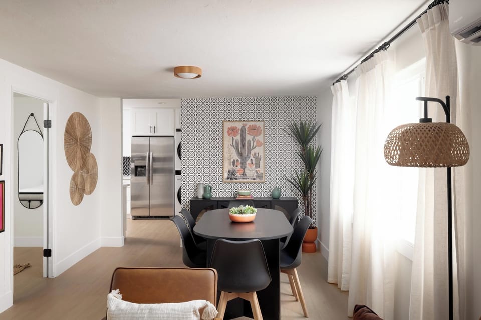 Stylish dining space with seating for six, bold accent wall
