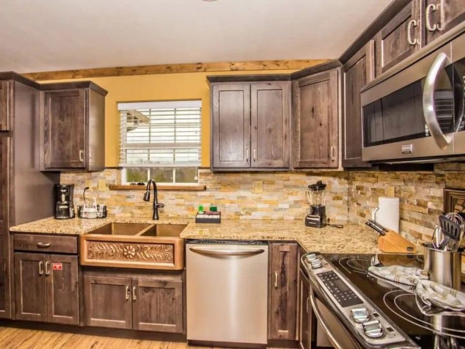 Kitchen with ample cabinetry and modern fixtures.