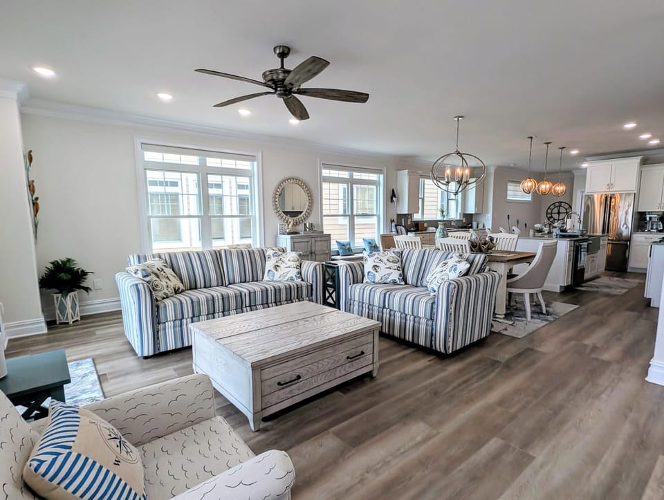 Living Room (2nd Floor) - Open-concept into dining and kitchen w/ porch