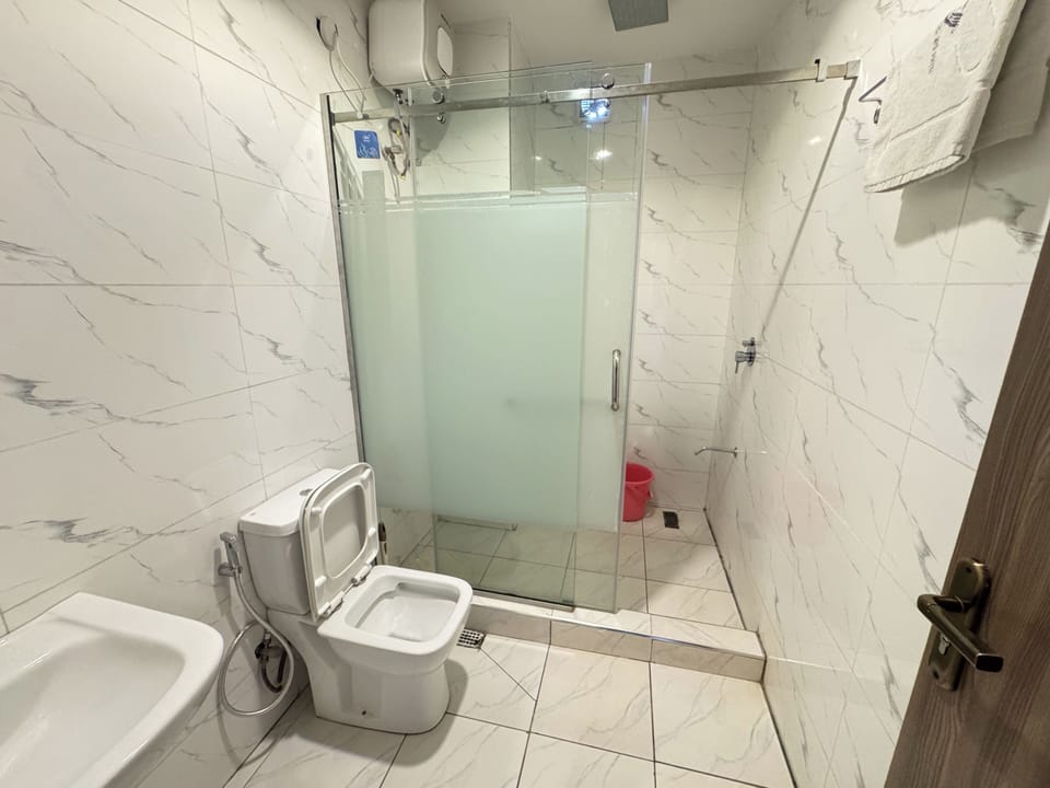 Shower, slippers, towels, soap