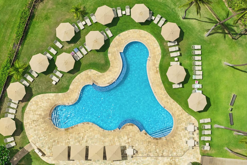 Relax under the shaded umbrellas that surround the pool deck. Jump into the ocean just a few steps away.