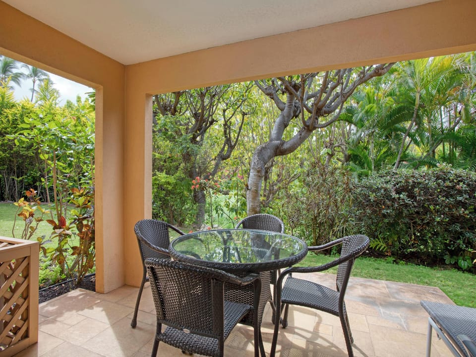 Large Covered Lanai: Relax on your private outdoor covered porch surrounded by peaceful garden foliage.