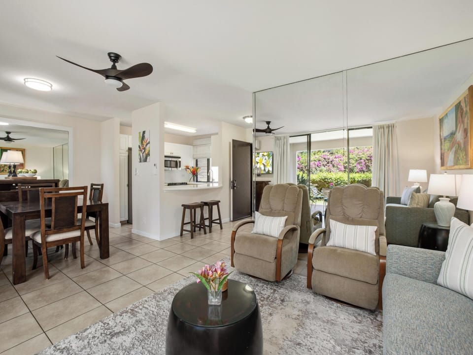 Step into your bright, open living space where comfort meets style. Relax in plush seating while enjoying natural light streaming through garden views, with a modern kitchen just steps away for easy meal prep.