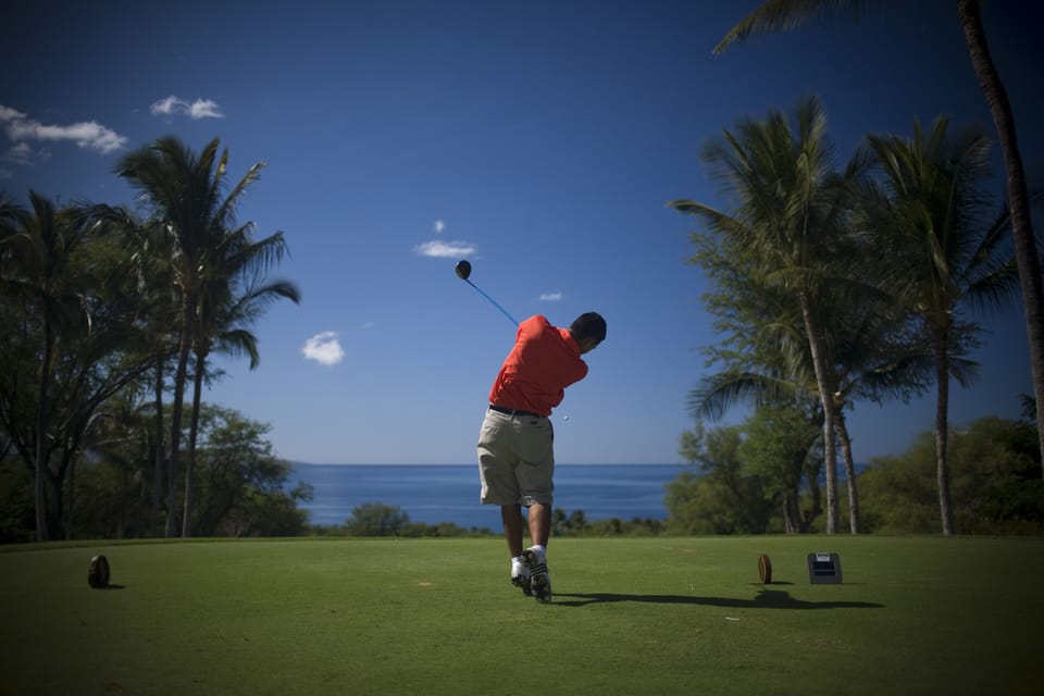 Pristine oceanfront golf course framed by swaying palms and endless blue horizons, offering championship play in a tropical paradise setting.