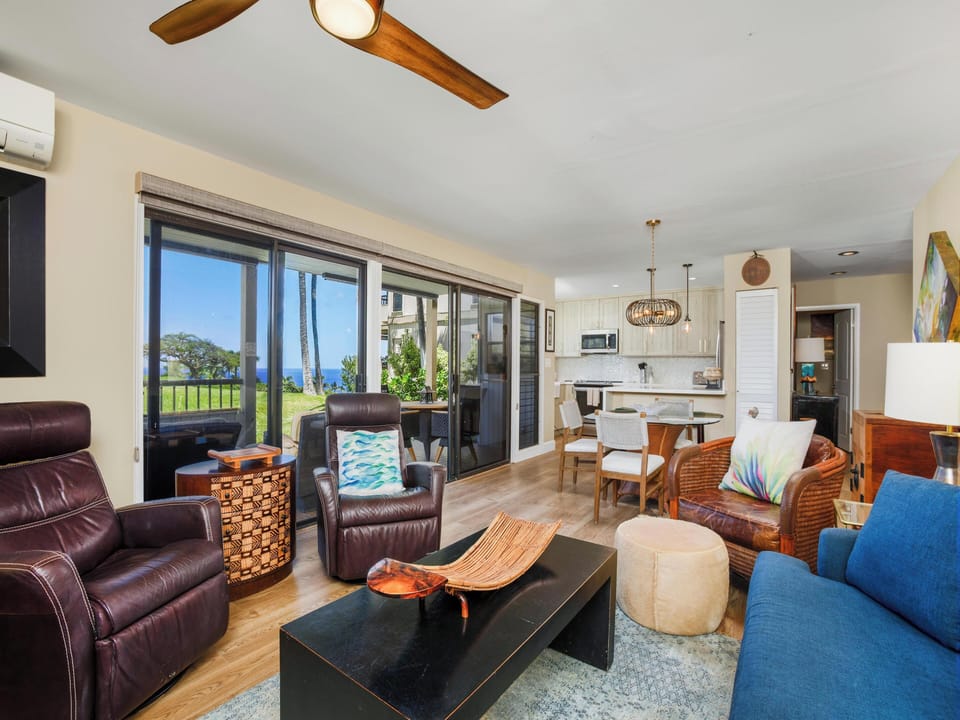 Unwind in your spacious living area where coastal breezes and ocean views blend seamlessly with comfortable furnishings, creating the perfect retreat for relaxation and memorable gatherings.