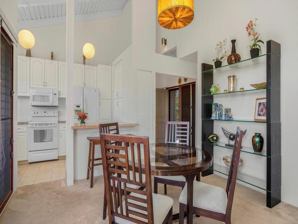 Gather at the indoor dining table, or take your meals out to the lanai.