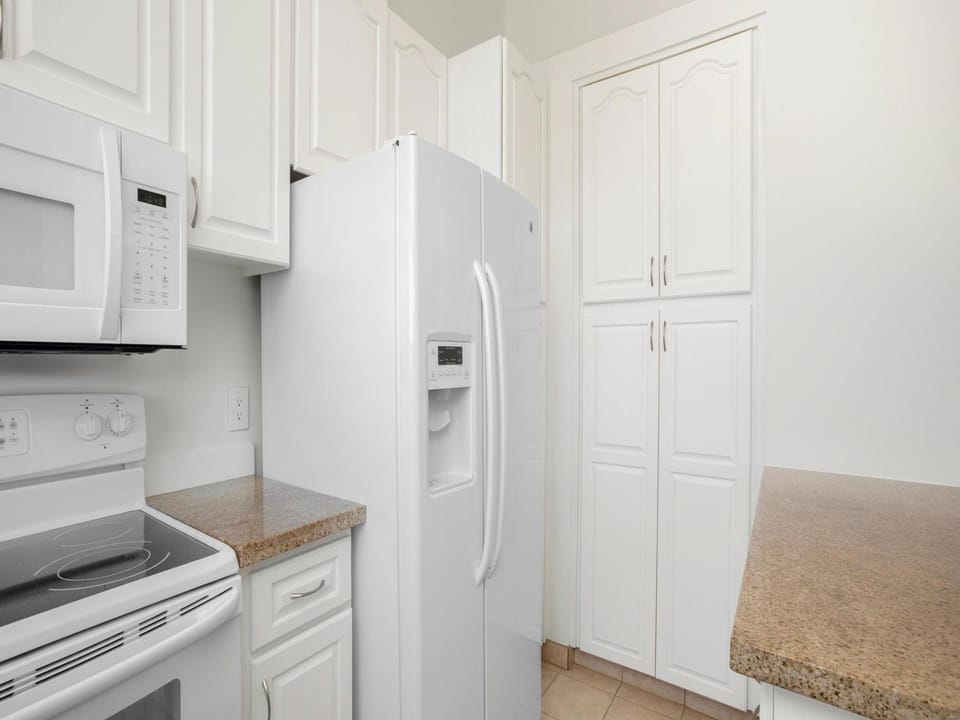 Oven, microwave, dishwasher, refrigerator, and an ice dispenser.