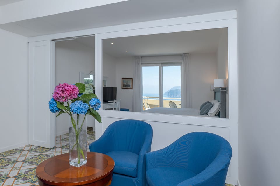 Junior Suite, Balcony, Sea View | Minibar, in-room safe, desk, blackout drapes