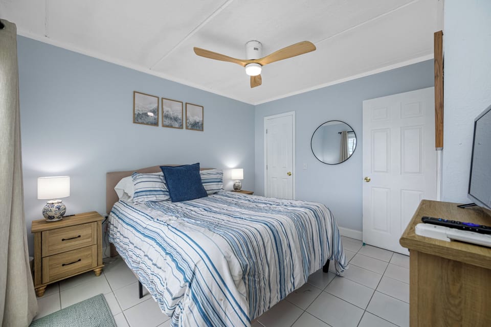 Bedroom with clothing storage & ceiling fan