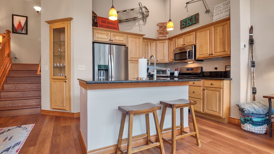 Bright and functional kitchen with breakfast bar charm.