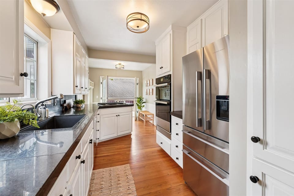 Modern appliances complement the home's vintage character and create a stylish balance of history and function.