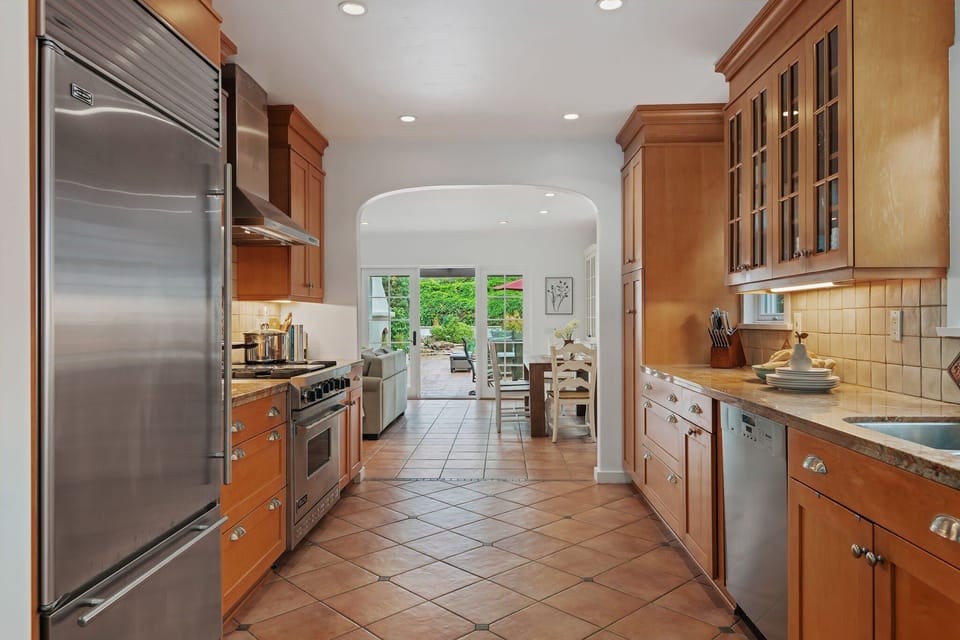 The kitchen offers ample countertop space and premium appliances