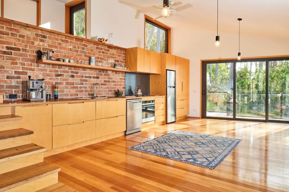 Sleek timber cabinetry with modern appliances
