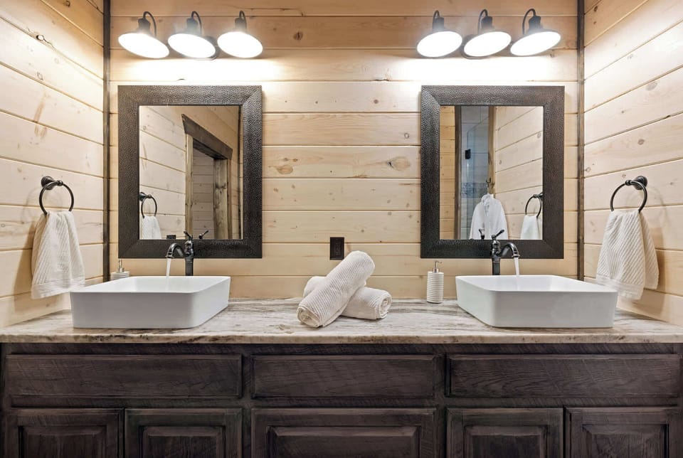 No need to share! Unless you want to, of course. Our stunning bathroom features a spacious double vanity, ensuring everyone has their own dedicated space to shine. 