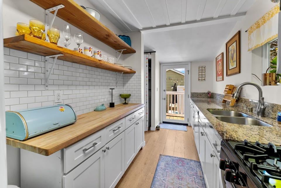Fully equipped kitchen with retro-inspired design and modern convenience.