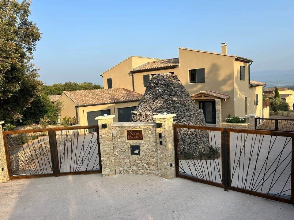 Circular front entrance with remote controlled double gates.