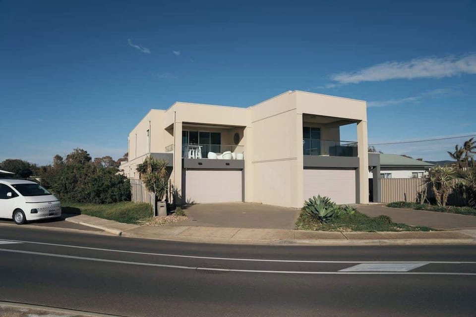Front View and Guest double garage and off-street parking for 4 cars