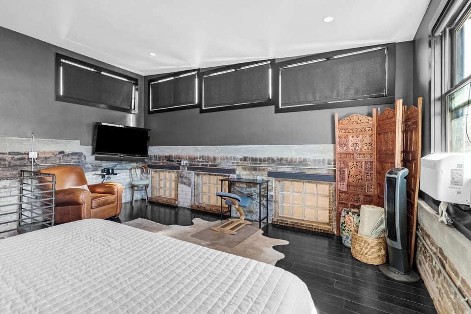 King Bedroom with black out shades and streaming TV